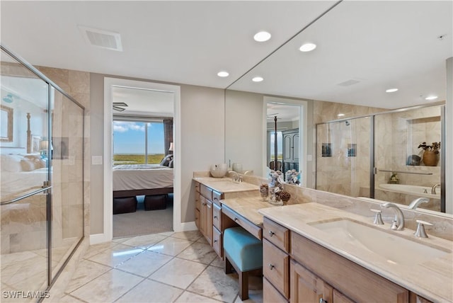 bathroom with visible vents, connected bathroom, vanity, a shower stall, and recessed lighting