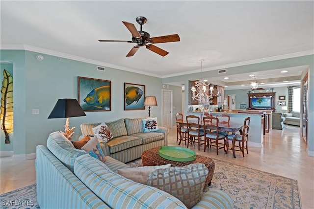 living room with baseboards, visible vents, and crown molding