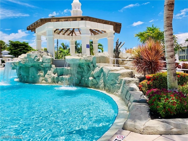 outdoor pool featuring a gazebo