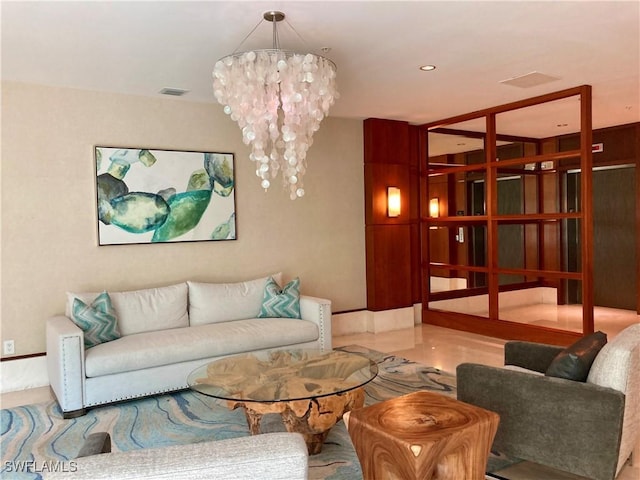 living room with recessed lighting, visible vents, and an inviting chandelier