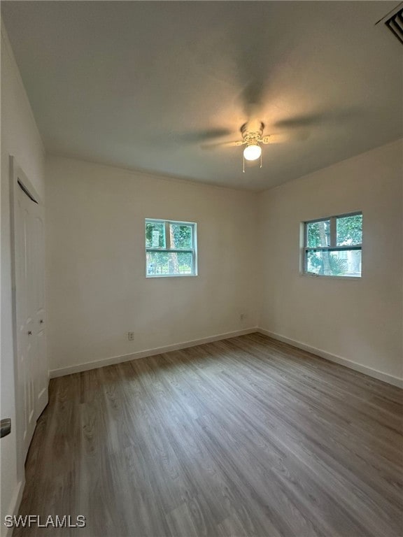 unfurnished room featuring wood-type flooring and ceiling fan