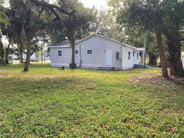 view of home's exterior featuring a yard