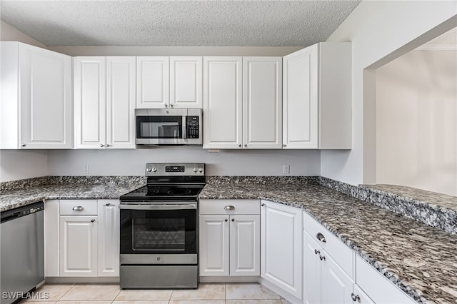 kitchen with white cabinetry and appliances with stainless steel finishes