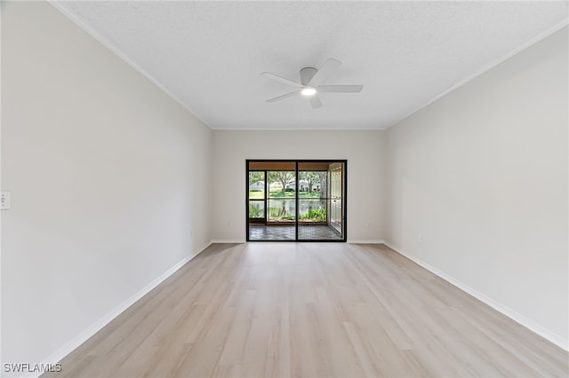 spare room featuring ceiling fan, light hardwood / wood-style floors, and ornamental molding