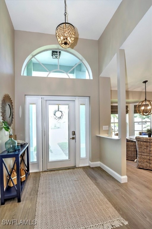 entrance foyer featuring an inviting chandelier and light hardwood / wood-style floors