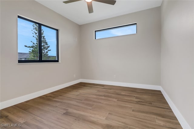 unfurnished room featuring hardwood / wood-style floors and ceiling fan