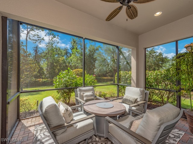 sunroom / solarium with ceiling fan