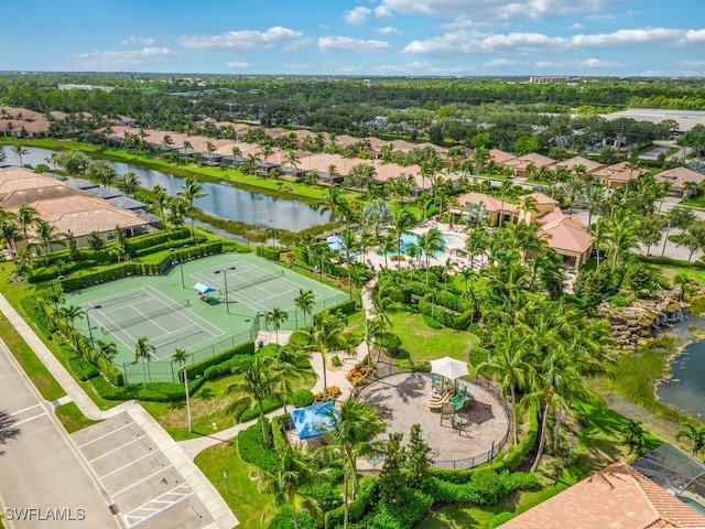 birds eye view of property with a water view