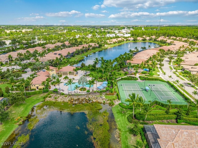 birds eye view of property with a water view