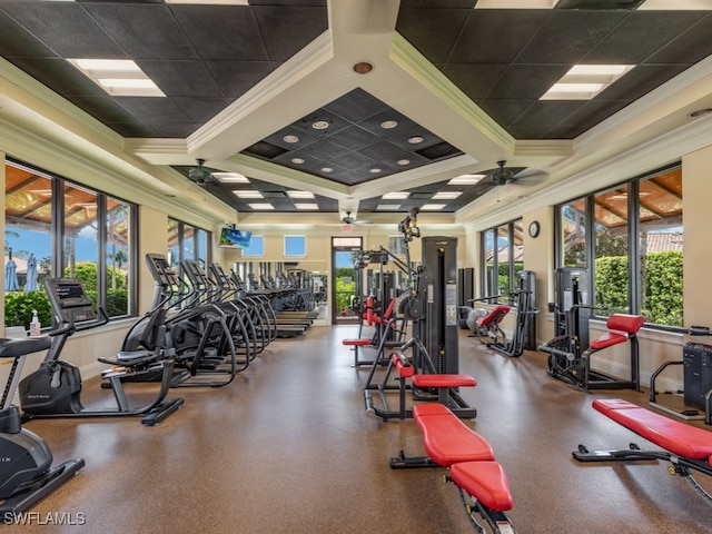 workout area with ceiling fan, ornamental molding, and coffered ceiling