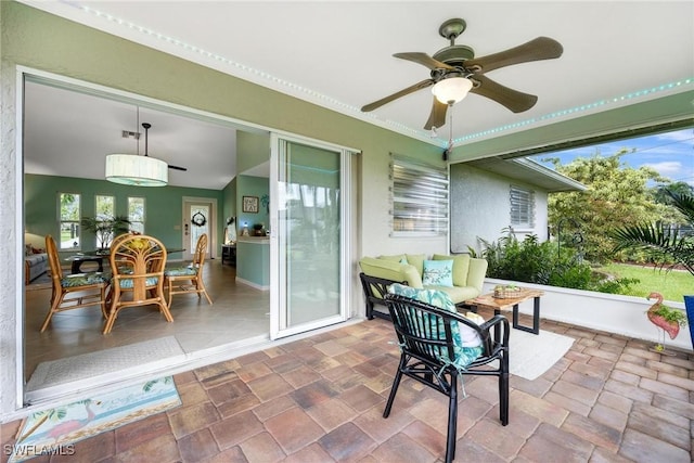 sunroom / solarium with ceiling fan