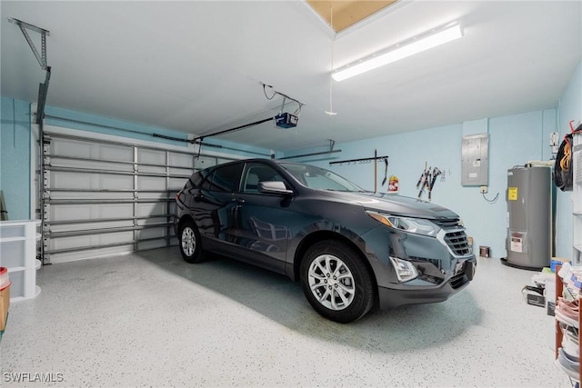 garage featuring water heater, a garage door opener, and electric panel