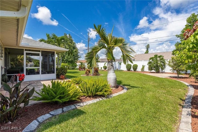 view of yard with a sunroom