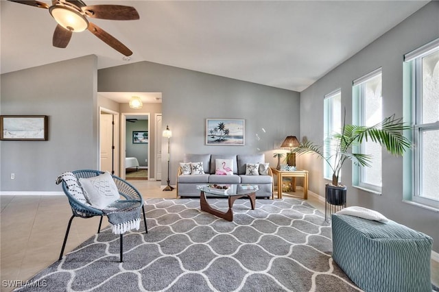 living room featuring ceiling fan, plenty of natural light, lofted ceiling, and tile patterned flooring