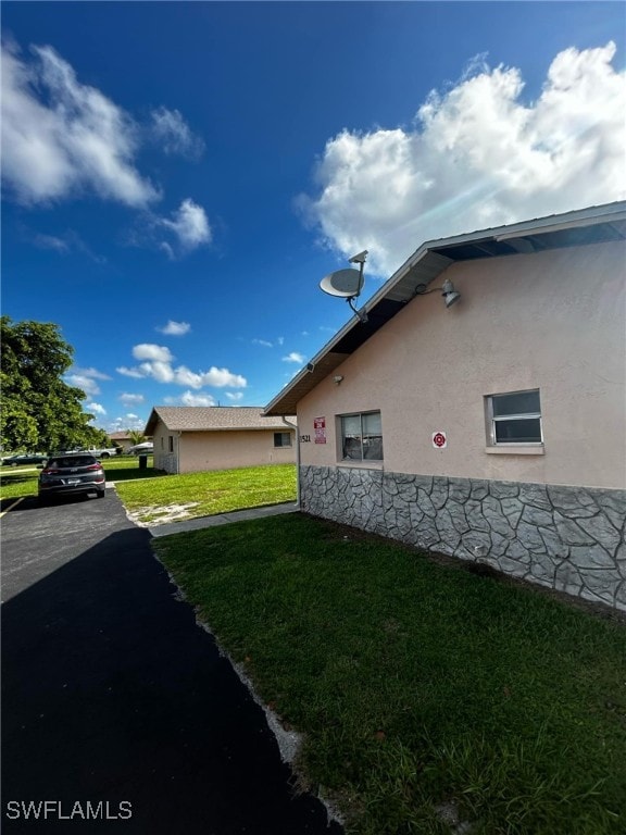 view of property exterior featuring a yard