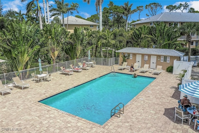 3041 Sandpiper Bay Cir Unit H201, Naples, FL 34112 - community pool with a patio area
