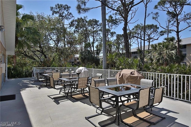 3041 Sandpiper Bay Cir Unit H201, Naples, FL 34112 - view of patio / terrace with outdoor dining area