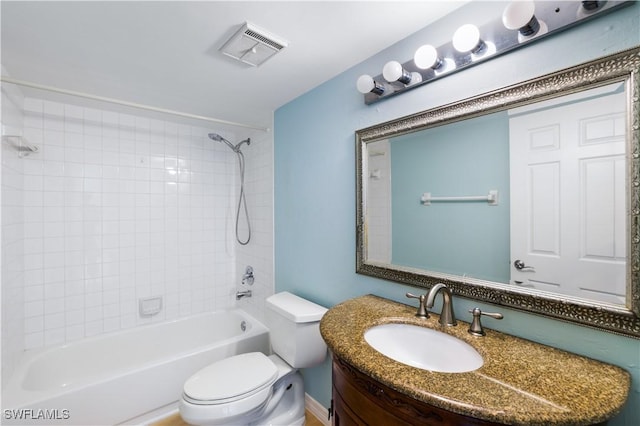 bathroom featuring toilet, bathing tub / shower combination, visible vents, and vanity