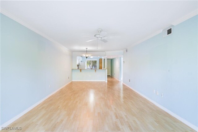 3041 Sandpiper Bay Cir Unit H201, Naples, FL 34112 - unfurnished living room with ceiling fan, light wood finished floors, and ornamental molding