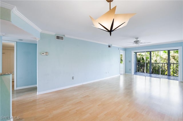 empty room with baseboards, visible vents, ceiling fan, light wood-style flooring, and ornamental molding