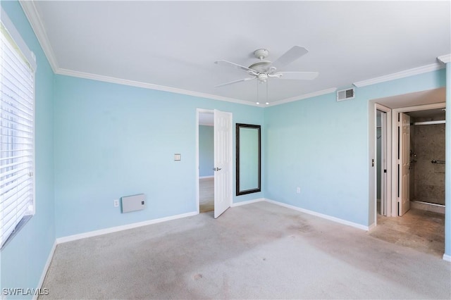 unfurnished bedroom featuring baseboards, visible vents, carpet flooring, and ornamental molding