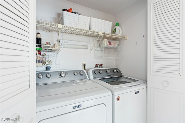 laundry room with independent washer and dryer