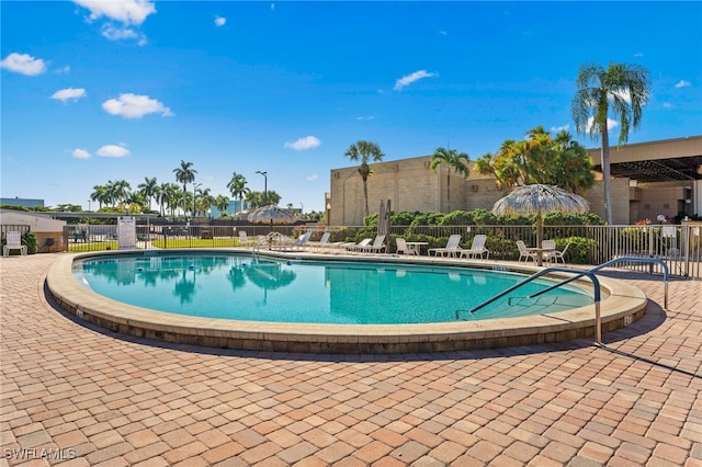 view of swimming pool with a patio area