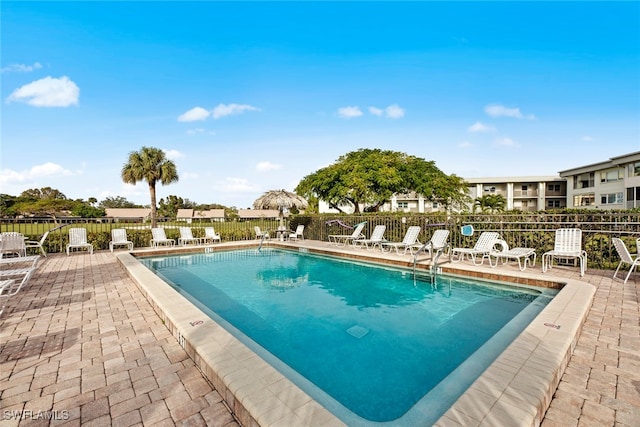 view of swimming pool featuring a patio area