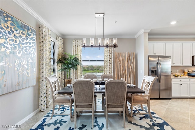 dining room featuring crown molding, light tile patterned floors, and an inviting chandelier