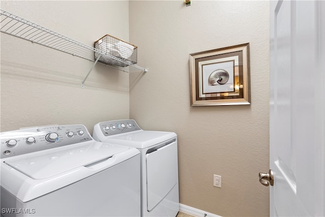 laundry room featuring washer and clothes dryer