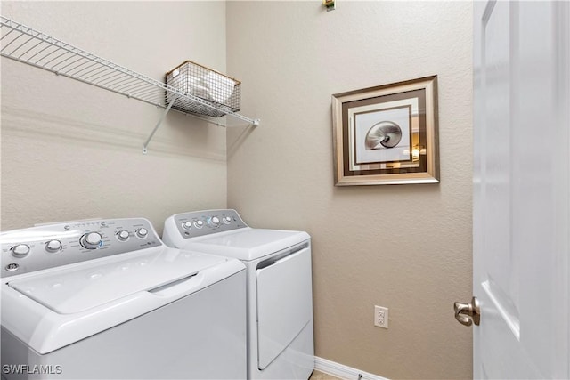 16564 Kingwood Ln Unit 35-201, Babcock Ranch, FL 33982 - laundry room featuring baseboards, washer and dryer, and laundry area