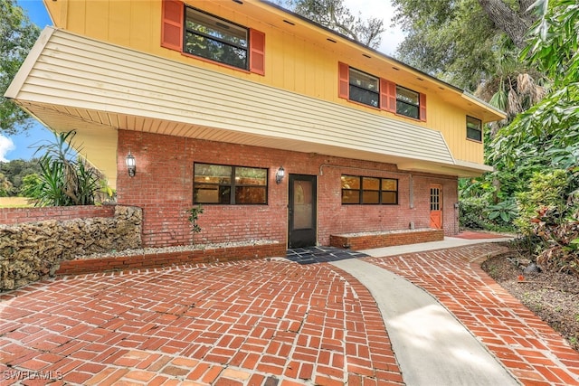 view of front of home featuring brick siding