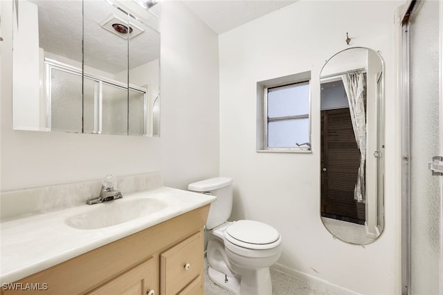 18191 Slater Rd, North Fort Myers, FL 33917 - bathroom with baseboards, vanity, an enclosed shower, and toilet
