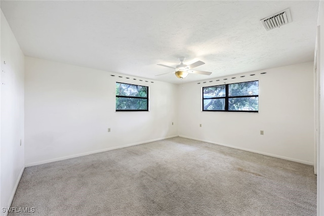 18191 Slater Rd, North Fort Myers, FL 33917 - empty room with carpet, visible vents, baseboards, and ceiling fan