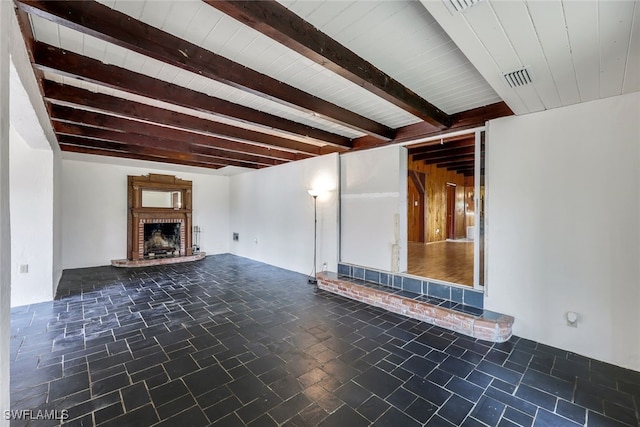 18191 Slater Rd, North Fort Myers, FL 33917 - unfurnished living room with a brick fireplace, beam ceiling, and visible vents