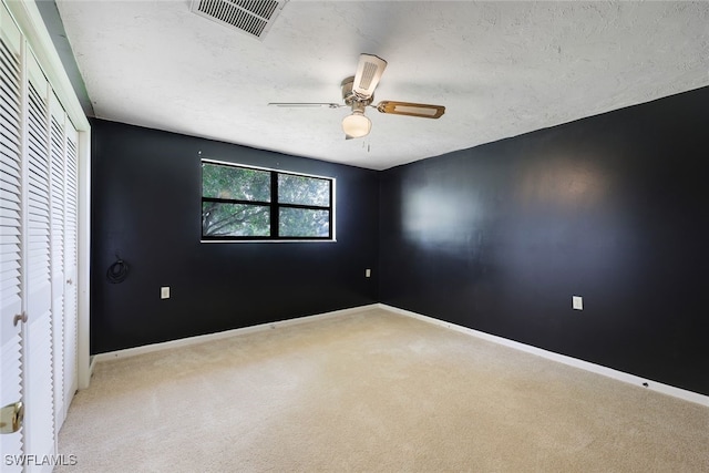 18191 Slater Rd, North Fort Myers, FL 33917 - unfurnished room featuring baseboards, a ceiling fan, visible vents, and carpet