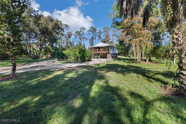 view of yard with a wooden deck