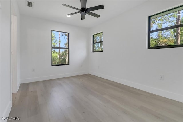 unfurnished room featuring ceiling fan and light hardwood / wood-style floors