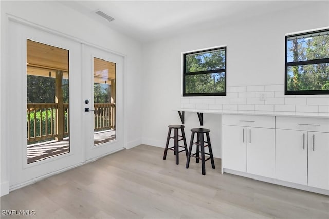 dining space featuring light hardwood / wood-style floors and plenty of natural light