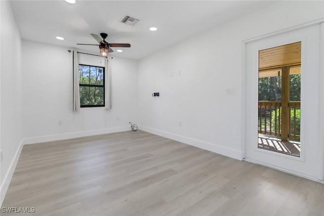 spare room with ceiling fan and light hardwood / wood-style flooring