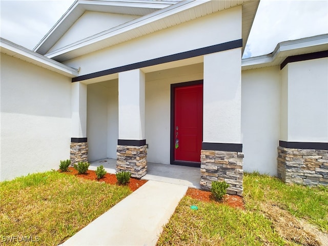 entrance to property featuring a porch