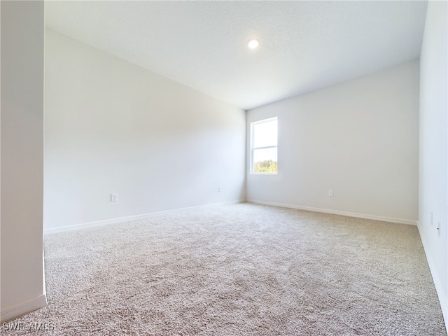 spare room featuring carpet flooring