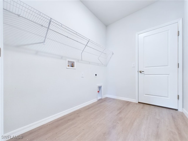 laundry area with washer hookup, hookup for an electric dryer, and light wood-type flooring