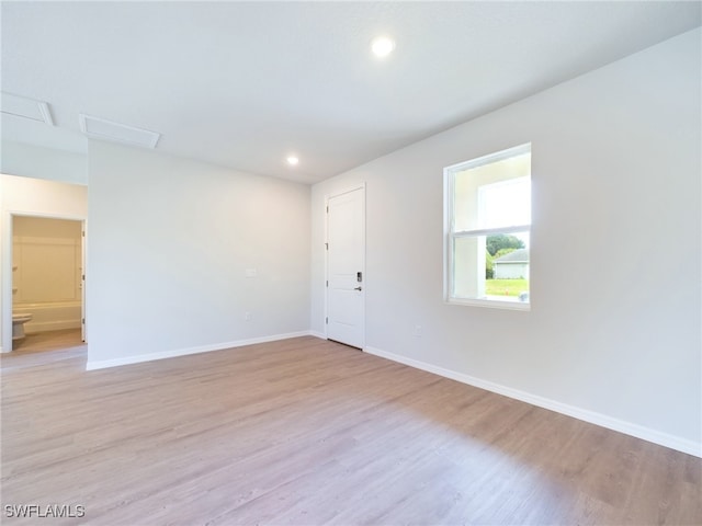 unfurnished room featuring light wood-type flooring