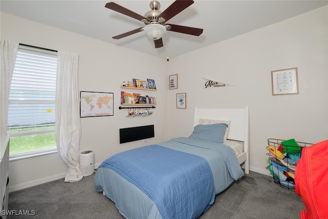 bedroom featuring multiple windows, carpet, and ceiling fan