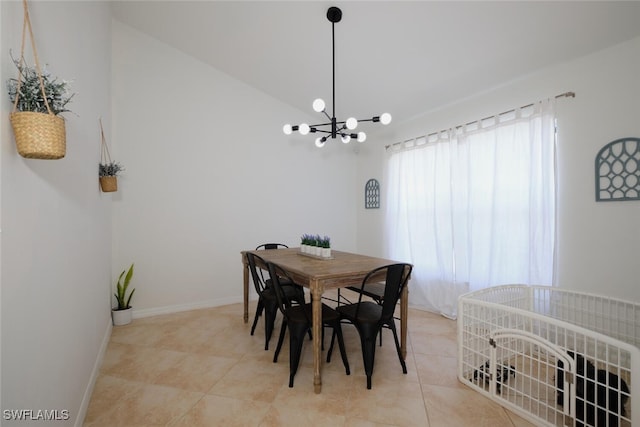 tiled dining room with a chandelier and lofted ceiling