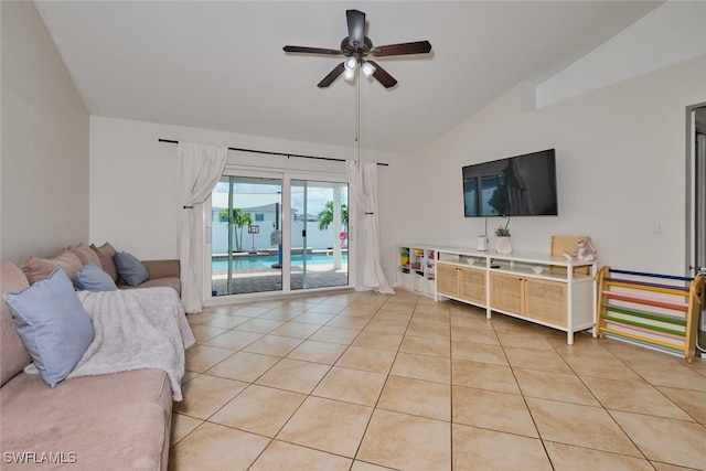 living room with light tile patterned floors, ceiling fan, and lofted ceiling