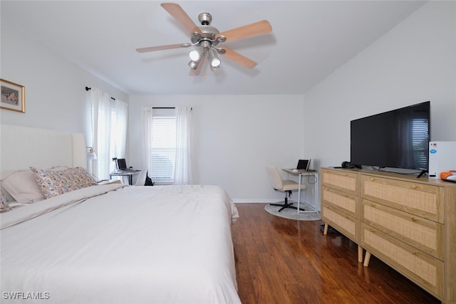 bedroom with ceiling fan and dark wood-type flooring