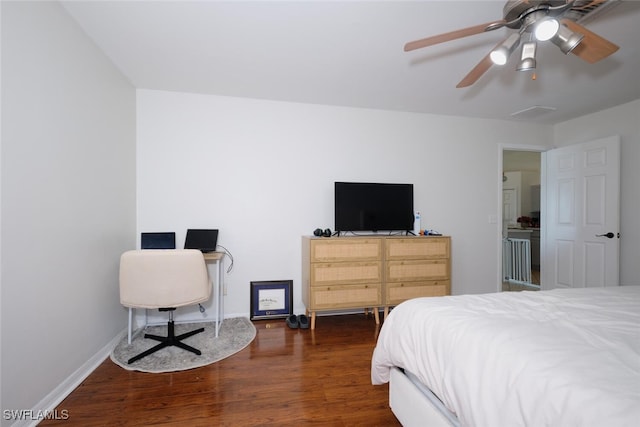 bedroom with ceiling fan and dark wood-type flooring