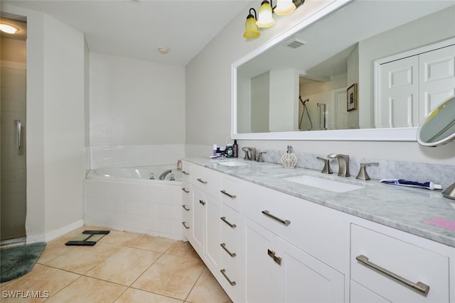 bathroom with tile patterned floors, vanity, and independent shower and bath